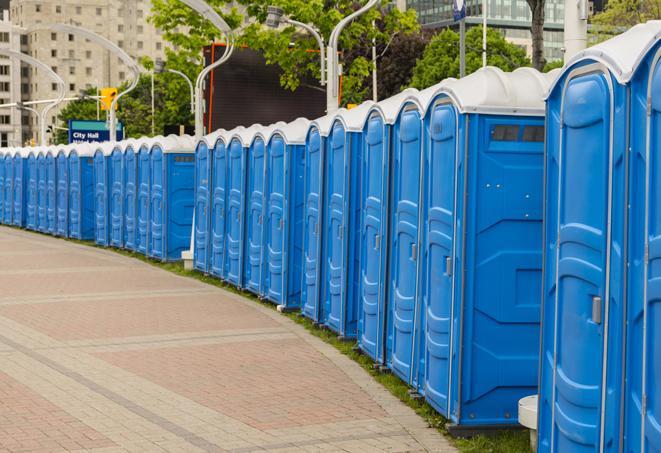 a row of sleek and modern portable restrooms at a special outdoor event in Blair